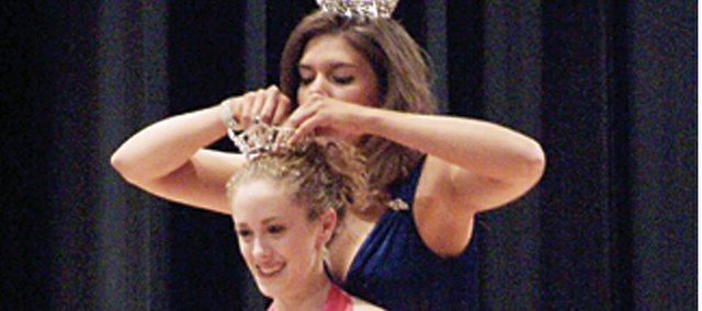 Basehor-Linwood High School freshman Jessica Farris is crowned Miss Leavenworth County Teen by Carol Toland, Miss Kansas River Valley 2007, during the Miss Leavenworth County, Miss Wooded Hills and Miss Leavenworth County Teen Pageant on Saturday at BLHS. Farris, a first-time teen pageant contestant, is now eligible to compete in the Miss Kansas Outstanding Teen Pageant in February in Wichita.
