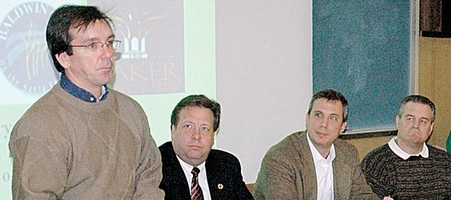Although temperatures outside were below freezing and windchills were worse, the topic at a Baker University forum Tuesday night was global warming and what could be done locally about it. Discussion panel members for the forum were, from left, Tony Brown, Baker professor and Baldwin City Council member, State Rep. Tom Holland, D-Baldwin City, Ivan Huntoon, president of the Baldwin City Chamber of Commerce, Baldwin School District Supt. Paul Dorathy, Roger Boyd, Baker professor, and William Miller, Baker professor. The forum was sponsored by Baker's Earth We Are.