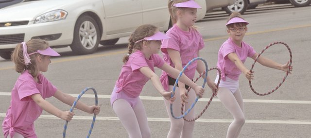 Emma Leonard, Charissa Dodd, Elizabeth Seidl and Katie Dossett - young students in Tauna Hill-Kelter's De Soto Parks and Recreation dance class - prepare to dance routine Saturday at the Spring Fling. The four-hour event brought a steady and impressive crowd to downtown to enjoy entertainment, food, vendor and community. For more photos, see Page 10A or look online at desotoexplorer.com.