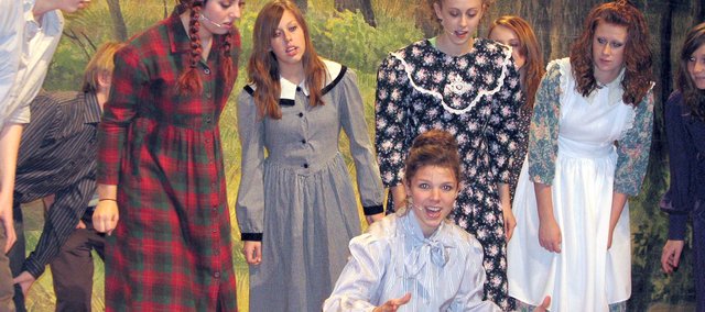 Anne Shirley (left), played by Nicole Theno, and classmates gather around their teacher Muriel Stacy, played by Andrea Adcox, during dress rehearsals for the Basehor-Linwood High School Musical production of "Anne of Green Gables" in November 2007. Adcox recently was nominated for a Blue Star Award for Best Featured Performer for her role as Miss Stacy.