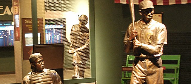 The Negro Leagues Baseball Museum's Field of Legends features a ballfield with several prominent Negro Leagues players at the tour's ending point. Pictured above are catcher Josh Gibson, batter Martin Dihigo and manager John "Buck" O'Neil on a makeshift dugout perch. The museum attracts anywhere from 50,000 to 60,000 visitors a year.