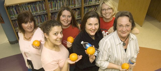 Tonganoxie Middle and Elementary schools staff members have started wellness programs for staff as a way to promote healthier lifestyles. Pictured, front row, from left, are Kyla Sandhoefner, TMS principal Jill Dickerson and Shelly Hunter. Back row, from left, are Mary Welsh, Heather DeMaranville and LeAnn Bond.