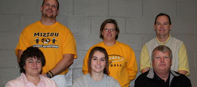 Basehor-Linwood senior Tiffany Jennings recently signed a letter of intent to continue her softball career at Kansas City Kansas Community College. Pictured at the signing ceremony are, from left, front row: Kathy Jennings, mother; Tiffany Jennings; Pete Jennings, father; and, back row: BLHS strength coach Ross Schwisow; BLHS softball coach Susan Mayberry and assistant coach Jeff Venema.