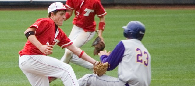 Tonganoxie High shortstop Jace Waters tags out Spring Hill's Colton Ghumm as he attempts to steal second base. The Chieftains were knocked to the consolation bracket by the Broncos for the second straight year at the Butch Foster Memorial Baseball Classic with Spring Hill's 8-1 win Friday afternoon.
