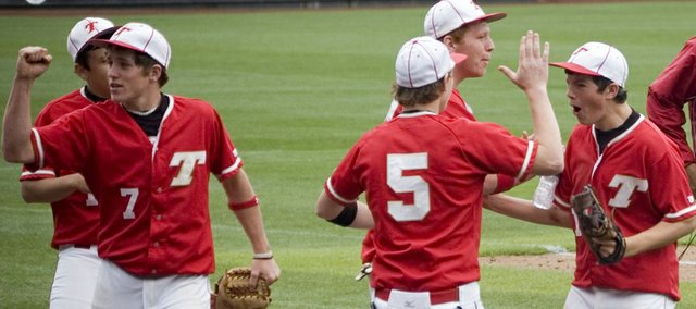 The Tonganoxie High baseball team was fired up after losing its first game in the Butch Foster Memorial Baseball Classic on Friday and responded with two big victories this past weekend at CommunityAmerica Ballpark in Kansas City, Kan. After ending an inning with a double play on Friday, Jace Waters gives a fist pump as Jon Harris high-fives Dylan Puhr.