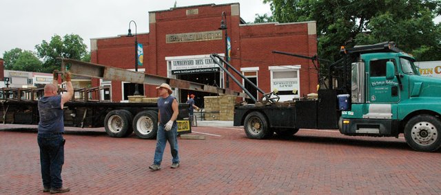 Workers from Richman Helstrom Co. removed the largest of the steel beams used to jack the Lumberyard Arts Center building up to allow a concrete floor to be poured. The removal stopped traffic on High Street for around an hour Tuesday morning. Jim Niehoff, construction foreman for the project, answered questions regarding the project to create a home for the arts in downtown Baldwin City.