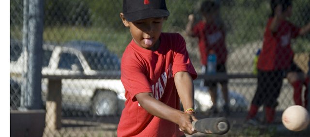 Kendall Smith hits a foam baseball off a tee during a Tonganoxie Recreation Commission blastball game at Leavenworth County Fairgrounds in July. Blastball, which is designed to introduce 4-year-olds to some baseball basics, was a successful first-year offering from TRC this summer, with four seven-player teams participating.