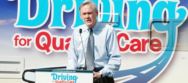 U.S. Rep. Dennis Moore addresses the crowd at the “Driving for Quality Care” tour, a project of the American Health Care Association and National Center for Assisted Living. Moore joked about a man in the crowd whose t-shirt read "you're not young forever," saying he just learned how to play The Beatles' "When I'm 64" on his guitar. The tour made a stop Friday in Shawnee.