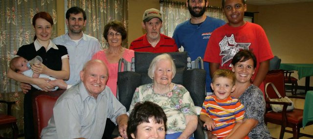 Dolores Finley, seated at center, poses with her family. Pictured from left to right, in back, are grandson Mike Bristow with wife and child, Margaret and Cameron; daughter Carol Bristow with husband, Richard; and grandsons Thomas Bristow and Corey Brantley. Her husband of 60 years, Jim Finely, is seated next to Dolores. Granddaughter Anne Bristow Slusher is holding Dolores’ great-grandson, Kellen. Dolores’ daughter, Linda Finley, is seated in front.