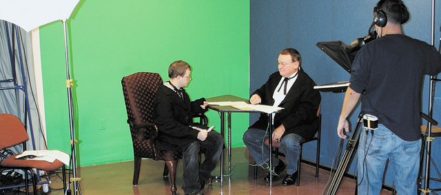 Matthew Marshall (left), a Kansas City Kansas Community College student, is filmed in a scene with Joe Vaughan (right), a member of the Wyandotte County Historical Society Board of Directors, as part of “The Wyandotte Convention 1859: How the Kansas Constitution Led to a Free State.” The short film, which documents the final day of the Wyandotte Convention, will be shown tonight at Kansas City Kansas Community College.