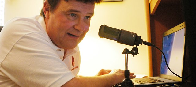 From inside his Shawnee home, Randy Birch provides the voice for the online radio show at BigJackpotBetting.com, designed to hype up greyhound racing and bring in online bets.