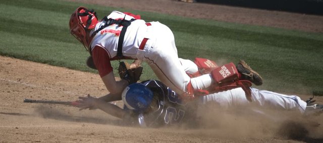 Tonganoxie High catcher Dylan Fosdick tags out Holton base runner Garrett Burns in the bottom of the fourth inning Thursday afternoon at CommunityAmerica Ballpark in Kansas City, Kan. The Wildcats came back from a six-run deficit to beat THS, 10-9, in the first round of the Butch Foster Memorial Baseball Classic.