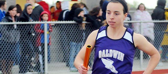 Baldwin High School sophomore Kaitlyn Barnes anchors the 3,200-meter relay last Thursday at Eudora. The Bulldogs easily won the race.
