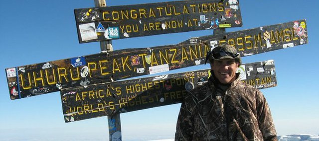 Matt Acree, a 2010 Mill Valley High School graduate and current Drake University football player, stands on the summit of Mount Kilimanjaro in Tanzania. Acree and his Drake teammates spent two weeks in May in Tanzania. While there, they played the first American football game on the African continent, performed volunteer work and then scaled the highest mountain on the continent. Even though he reached Kilimanjaro’s Uhuru Peak at 19,340 feet, Acree says his most memorable moment was a two-day home stay with a Chagga tribe in which he helped build a school.