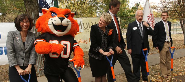 During a ground-breaking ceremony Friday at Baker University in Baldwin City, biology professor Darcy Russell, left, gets a poke from WOWzer the Baker mascot, as President Pat Long looks on with Hoot Gibson, Rich Howell and Caleb Watts. The group was marking the beginning of a project to expand science facilities at the university.