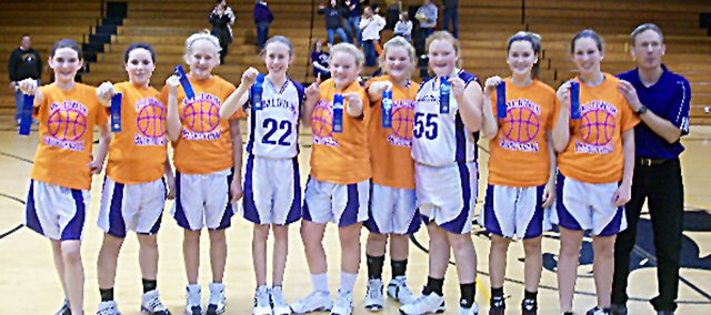 Baldwin Junior High School's eighth-grade junior varsity basketball squad went a perfect 10-0 this season and were the Frontier League Champions. Pictured, from left, are Erica Petry, Emily Weiss, Emma Burnett, Mackenzie Russell, Ashleigh Kramps, Mackenzie Ellis, Samantha Brinkmann, Katie Behrens, Analise Gill and coach Dane Jorgensen. Not pictured is Amber Garrett.