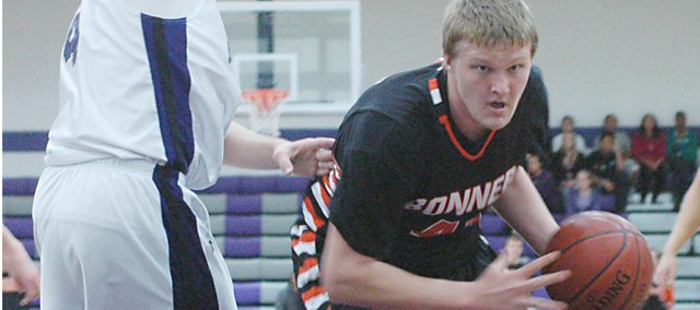 Brett Steuart drives to the basket during Bonner Springs’ 61-27 victory against Piper on Tuesday. Steuart scored the game’s first eight points and finished with 12.