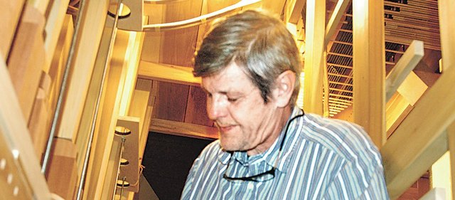 Martin Pasi, owner of Pasi Organ Builders Inc. in Roy, Wash., works on “voicing,” or tuning, the new pipe organ he is installing at Hope Lutheran Church in Shawnee. The 25-foot pipe organ will feature 1,508 pipes, as well as Kansas-themed hand carvings, and will be located in the balcony of the sanctuary.  