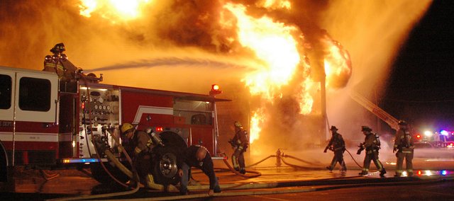 Firefighters battle a massive fire — fueled by high winds — at the Hampton Woods apartment complex, near 67th Street and Renner Road. The fire was reported about 7:15 p.m. Thursday. Shawnee Fire Chief John Mattox said everyone got out of the building safely, but “it’s only getting worse with this wind.” At 9 p.m., firefighters continued to pump water on a neighboring building to prevent it from catching fire, too. Jared Thornburg, who lives in the second building, came outside when the fire was reported. “It was a tiny, little fire in the bottom apartment over there,” he said. “… and it went up.”