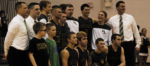 The Basehor-Linwood boys basketball team poses with its Class 4A sub-state trophy after defeating Topeka Hayden 58-51 on Saturday. The Bobcats relied heavily on senior Colin Murphy, who led the team with 24 points. Stay tuned for more coverage and photos, and find out who and when the Bobcats will play to begin the state tournament.