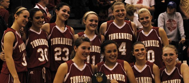 The Tonganoxie girls basketball team gathers around its Class 4A sub-state runners-up trophy on Saturday at Bonner Springs. The Chieftains lost, 58-50, in the championship game against No. 1-seed Bonner Springs. Junior Jenny Whitledge led the team with 12 points. Seniors Amanda Holroyd and Tavia Brown added nine and eight points, respectively. Sophomore Emma Stilgenbauer and junior Hannah Kemp each scored seven points. Stay tuned for a full recap and additional photos from the game.