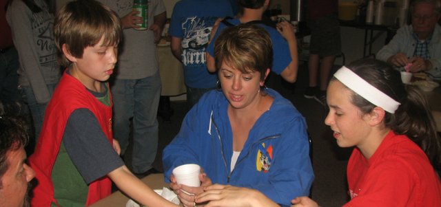 Basehor Intermediate School fifth-grader Jake Ulreich serves drinks to Amy Donnelly of Basehor and her daughter Jenna, an eighth-grader at Basehor-Linwood Middle School, at the Basehor VFW Post on Friday, April 13. Donnelly's son Dylan, also in fifth grade at BIS, was also helping serve diners during the post's spaghetti fundraiser for BIS fifth-graders' Wreaths Across America projects. Dylan comes regularly to the post's twice-a-month breakfasts, Amy said. "He loves to come down here," she said.