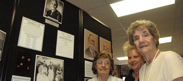 The Basehor Historical Museum’s new exhibit on the agricultural history of southern Leavenworth County is the fruit of research conducted by (from left) Earlene Ebert, Carla Crawford and Anna Jean Breuer, with the help of records donated by the Leavenworth County Kansas State University Extension office.