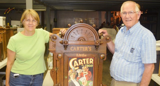 Dr. Bruce Hodges and his wife, Cathy, are pictured with one of the more than 5,000 artifacts to be displayed at Medicine's Hall of Fame & Museum in Shawnee.