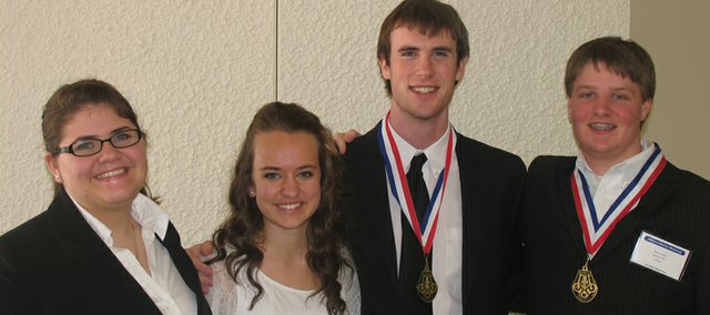 Baldwin High School had four students, the most ever, selected this year to play in the Kansas Music Educators Association Honor Band. The students selected are sophomore Kymbr Simmons, junior Cassidy Markley and seniors Austin Kraus and Brian Cooper. The two seniors were three-time selections to the band.
