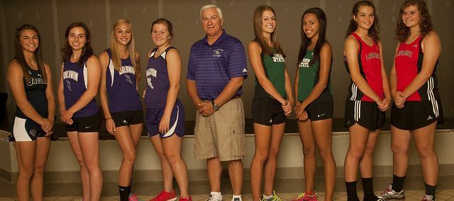 The 2013 Journal-World All-Area Girls Track & Field Team is: Emily Brigham, Mill Valley; Kaitlyn Barnes, Baldwin; Morgan Lober, Baldwin; Katie Kehl, Baldwin; Coach of the Year Ted Zuzzio, Baldwin; Bailey Sullivan, Free State; Athlete of the Year Alexa Harmon-Thomas, Free State; Matia Finley, Lawrence; and Rebecca Finley, Lawrence. Not pictured: Laura Kennard, Free State; and Jenny Whitledge, Tonganoxie.