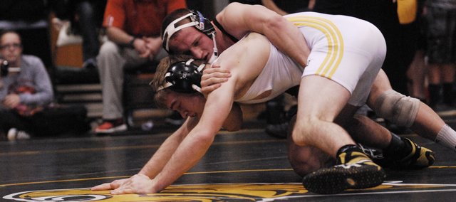 Aaron Puckett was one of two state champion wrestlers at Bonner Springs High in 2012-13. BSHS coach Brandon Jobe called the International Olympic Committee's decision to recommend that wrestling be removed from the list of core Olympic sports a "wake-up call" that the sport needed to modernize.