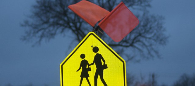 Construction flags have been place atop the crosswalk signs at Us. Highway 56 and Fourth Street and those on the North Sixth Street crosswalk to give them added visibility. The Baldwin City Council was told Monday the Kansas Department of Transportation said it will consider the city's request of traffic studies at the two site for funding.