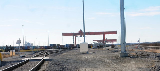 The cranes at the Burlington Northern Santa Fe Railroad intermodal 10 miles are now loading and unloading contain cars at the facility 10 miles east of Baldwin City. It is expected those working at the rail yard and adjoining warehouse complex will start looking to buy houses in Baldwin City two to three years after starting work at the site.