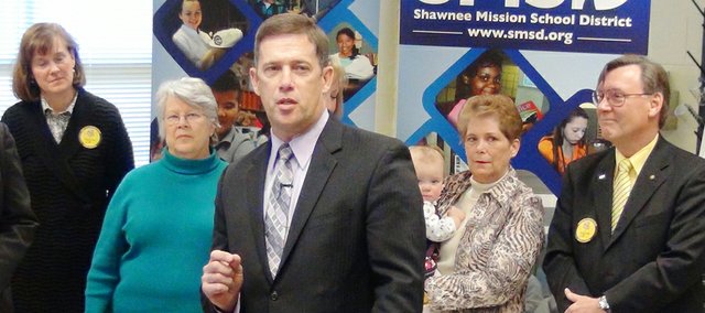 Jim Hinson, superintendent of schools for the Shawnee Mission school district, speaks during a press conference today announcing a $100,000 donation made by school board member Craig Denny and his wife, Terry, for STEM initiatives in the school district. Pictured from left to right are Linda Roser, Shawnee Mission Education Foundation executive director, Rene Gillespie, SMEF board president, Sara Goodburn and Donna Bysfield, school board members, Hinson, and Denny and his wife, Terry, with their granddaughter Aislyn.