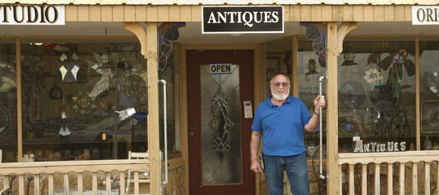 The old trading post at Globe has been the home, studio and store of David Anderson for the past nine years. In addition to antiques, Anderson and his partner and girlfriend Nedra Lynch sell his stained and leaded glass pieces, her paintings and the collaborative works that combine both their talents from the store. Those unfamiliar with Anderson's work can find two donated examples of his work on display Lumberyard Arts Center.