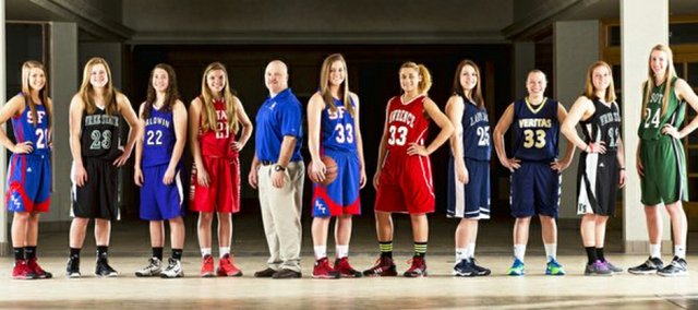 The 2014 Journal-World All-Area Girls Basketball Team, from left, Amber Moore, Santa Fe Trail; Madison Piper, Free State; Katie Jones, Baldwin; Corie Fischer, Ottawa; coach of the year Jayson Duncan, Santa Fe Trail; Shelby Dahl, Santa Fe Trail; Kionna Coleman, Lawrence; Carly Eaton, Mill Valley; Tori Huslig, Veritas Christian; Scout Wiebe, Free State; and Megan Bonar, De Soto.