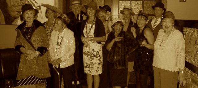 The Bonner Springs Rotary Club members and friends dress up in promotion of their Nov. 1 Speakeasy event, which will benefit Vaughn-Trent and Allegro Choirs.