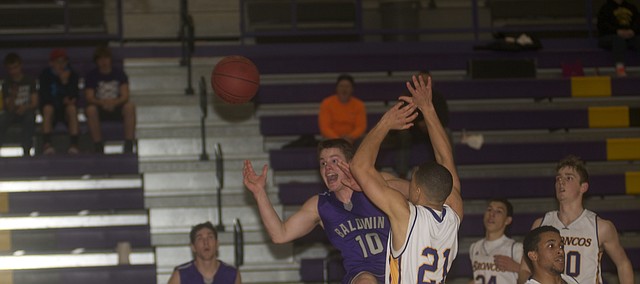 Baldwin senior Brock Randels is fouled late in Tuesday's 44-41 victory against Spring Hill. 