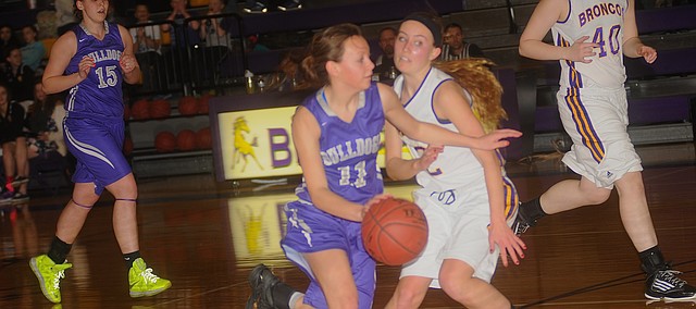 Baldwin junior Kyna Smith drives to the ball in the Bulldogs bounce-back victory Tuesday at Spring Hill. The Bulldogs play a tough De Soto team Friday on the Wildcats' home court.