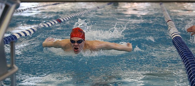 St. James junior Andy Maginn finishes up the butterfly in the 200-yard individual medley on Friday at the Class 5-1A preliminaries in Topeka. Maginn won the IM and took third in the 100-yard backstroke to qualify for the championship heat Saturday. 