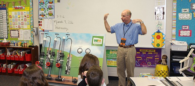 Jim Murray, manager of the Johnson County Landfill, speaks Wednesday to third graders at Horizon Elementary who last month tried to find solutions to the landfill's odor complaints.