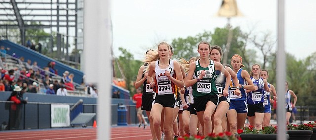 Shawnee Mission Northwest's Molly Born, bib 3594, leads the pack early in the girl's 3,200-meter run. Born would end up breaking away from Free State's Emily Venters, bib 2405, and win the race by 11 seconds. Born's time of 10:28.16 was a KU Relay's record and the fourth fastest time in state history.