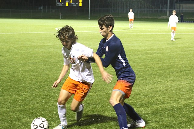 Shawnee Mission Northwest High School soccer junior Tristan Tepen (No. 17) dribbles the ball against Olathe East High School Tuesday night at the College Boulevard Activity Complex in Olathe.