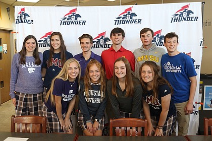 St. James Academy seniors Jake Fiscella, John Hunter, Kelly Kleekamp, Audrey Klemp, Bridget May, Page Mindedahl, Jack Moore, Jared Monk, Jackie Storm, and Caylee Thornhill pose after signing their letters of intent Wednesday at St. James Academy.