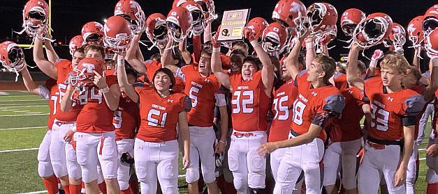 Tonganoxie High football players celebrate after defeating Spring Hill on Friday and becoming district champions. The 10-0 Chieftains now gear up for a clash with five-time defending state champion Bishop Miege this Friday at Beatty Field.