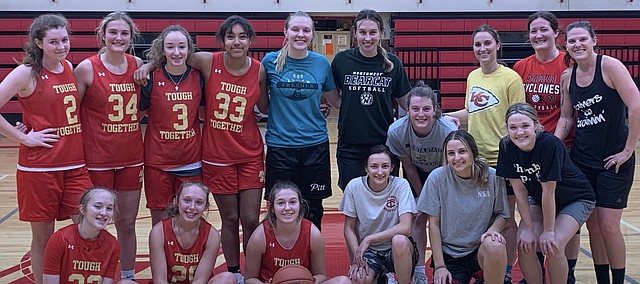 Tonganoxie High girls basketball players gather with alumni this past week. The THS girls team, as well as the THS boys team, had scrimmages against their alumni counterparts as part of winter break practice.