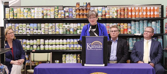 Gov. Laura Kelly appeared at Just Food in Lawrence on Monday to announce a new partnership aimed at address food insecurity statewide. Kelly was joined by U.S. Department of Agriculture Under Secretary Jenny Lester Moffitt, left, Kansas Secretary of Agriculture Mike Beam, second from right, and Stephen Davis, the president and CEO of Kansas City-area food bank Harvesters.