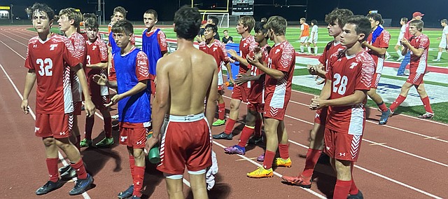 Tonganoxie High soccer players acknowledge the home crowd Thursday after tying Louisburg, 2-2, at Beatty Field. The Chieftains are 2-4-1 heading nto this week’s action. 