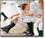 De Soto senior Danny Blades, center, contemplates the end of a
tough game against Mill Valley in regional play.