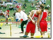Matt Needham, Tonganoxie senior, grabs hold of teammate Tony Aligo
following the 4x800-meter relay. THS Coach Phil Williams said that
Needham, in his final high school race, gave everything he had in
the race. He ran the team's fastest leg at 2:04.